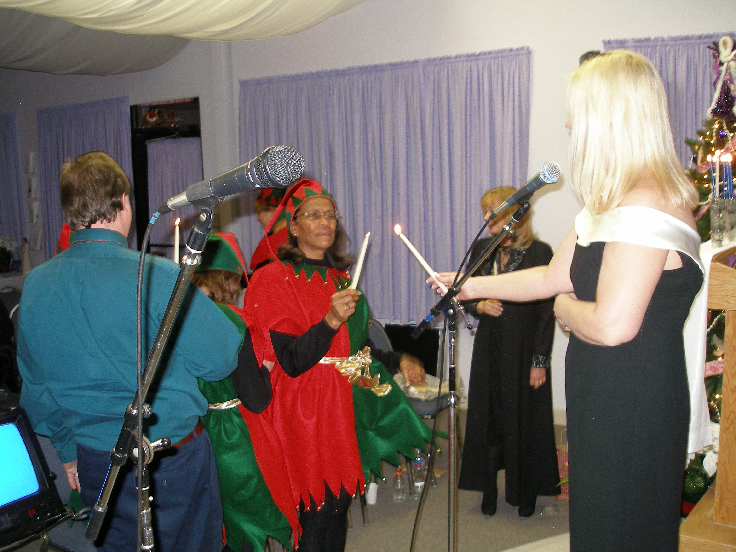 Candle lighting ceremony with elf carolers at Christmas Eve 2008