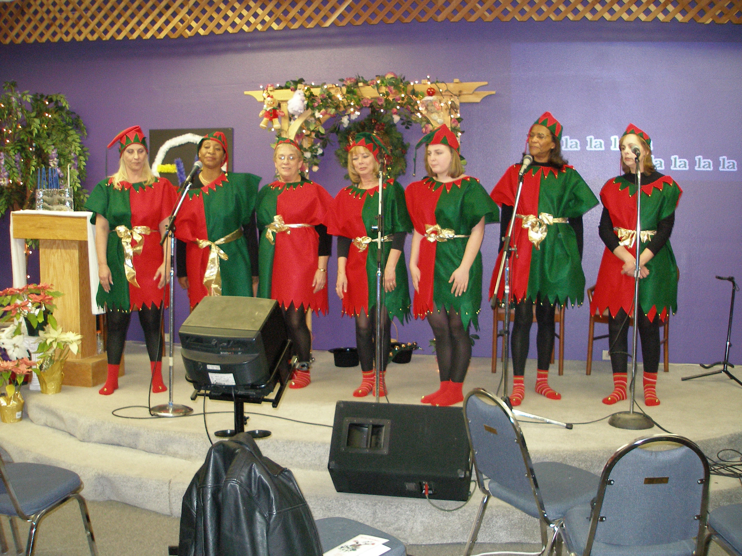 Elf carolers lined up on stage at Christmas Eve 2008