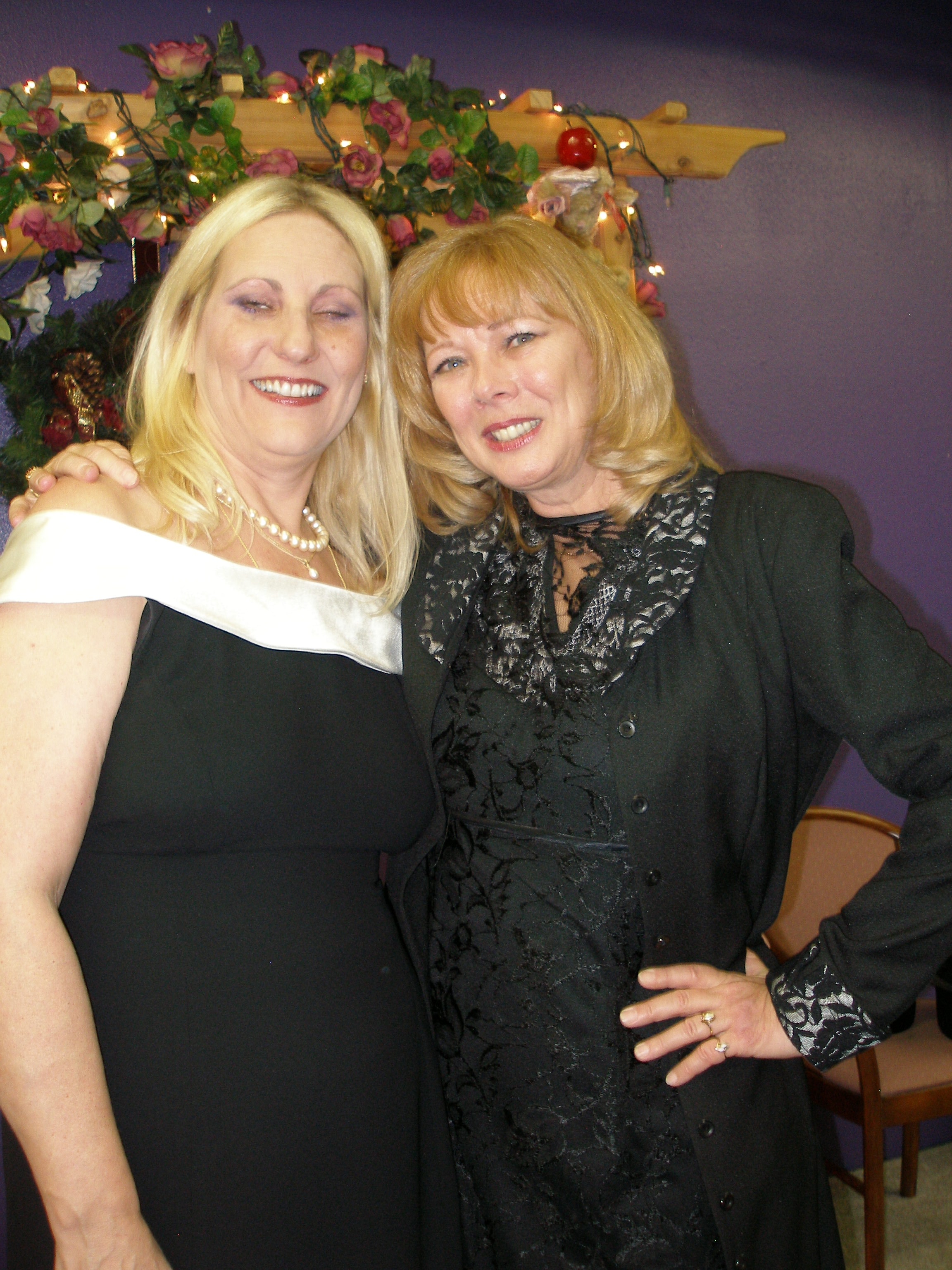 Two women posing together at Christmas Eve 2008 celebration