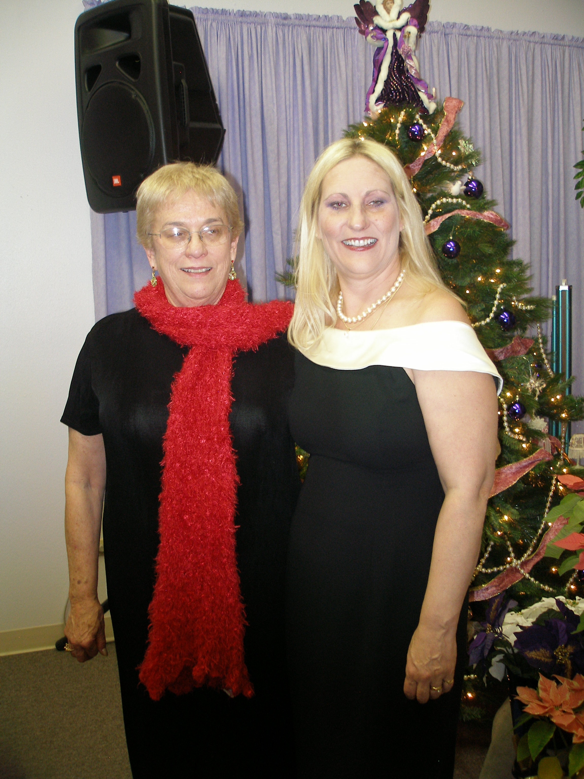 Two women posing by Christmas tree at Christmas Eve 2008
