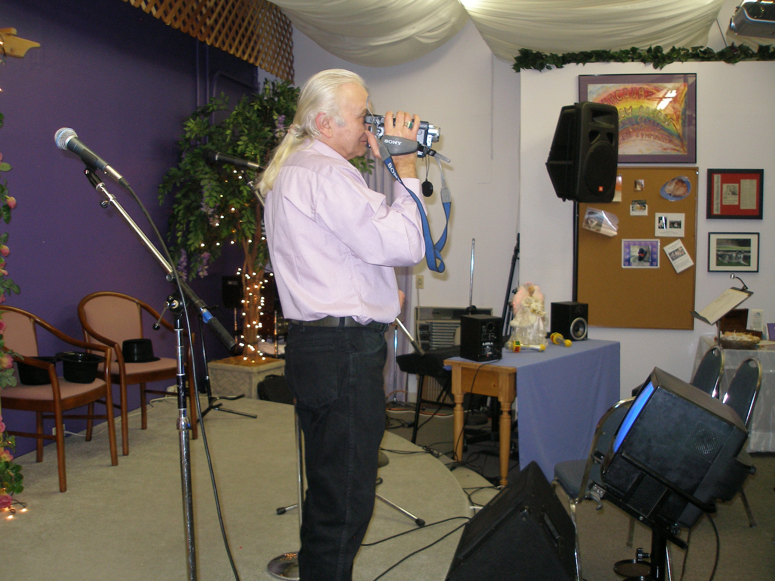 Videographer filming the Christmas Eve 2008 service at Oasis CSL