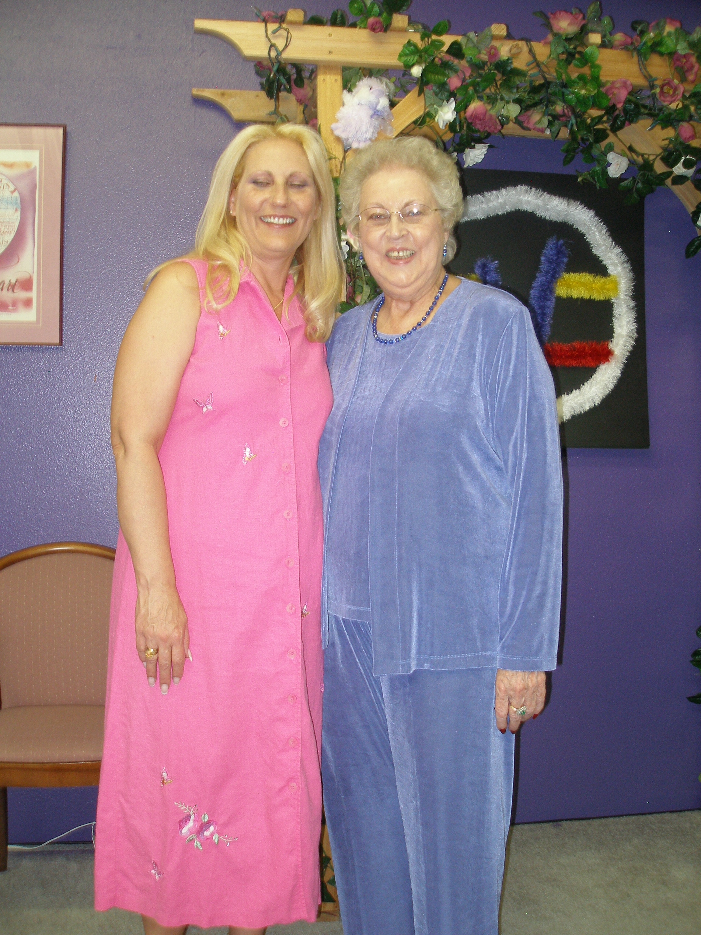 Two women posing together in the Oasis CSL sanctuary