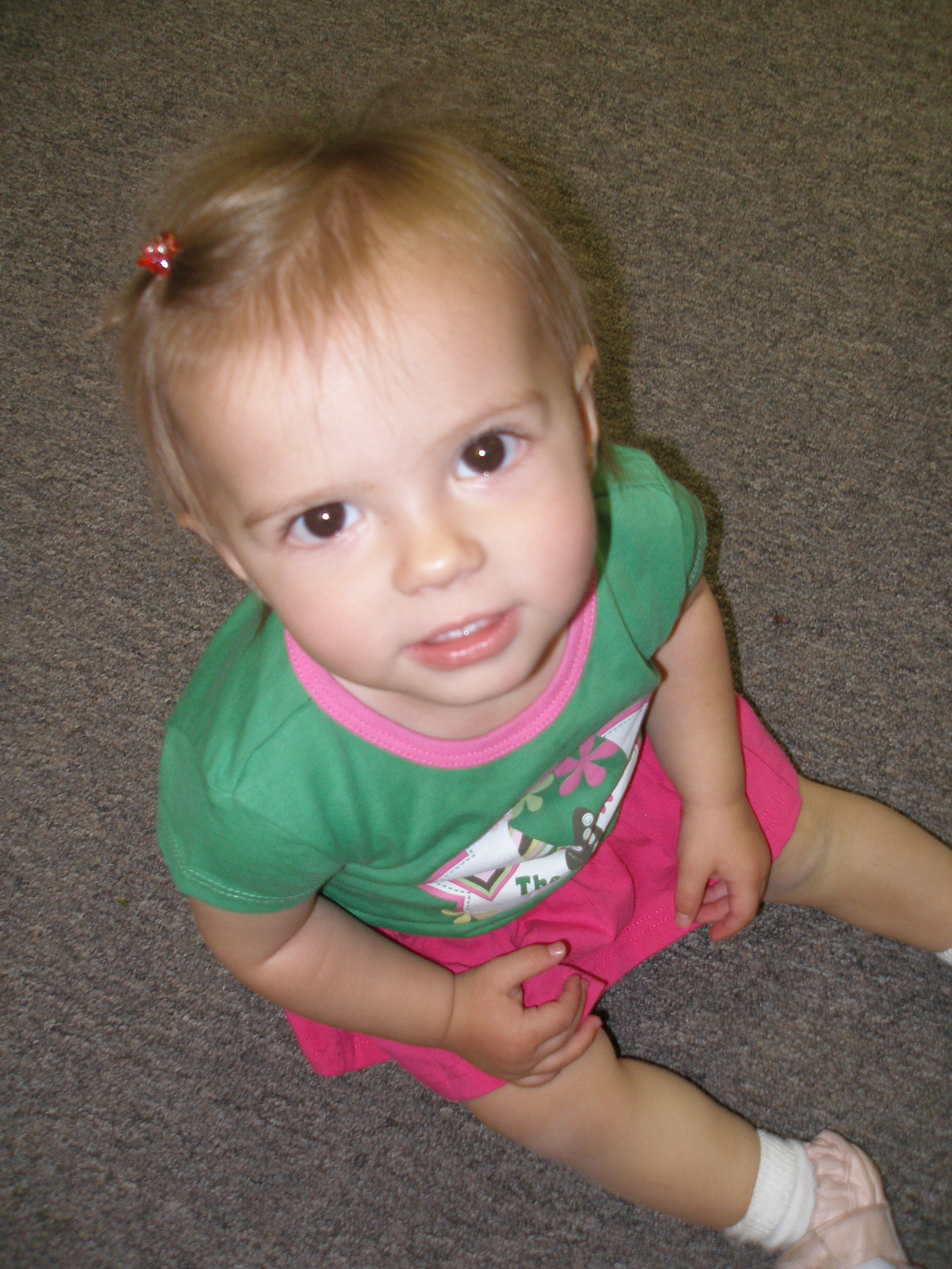Young child sitting on the floor at Oasis CSL
