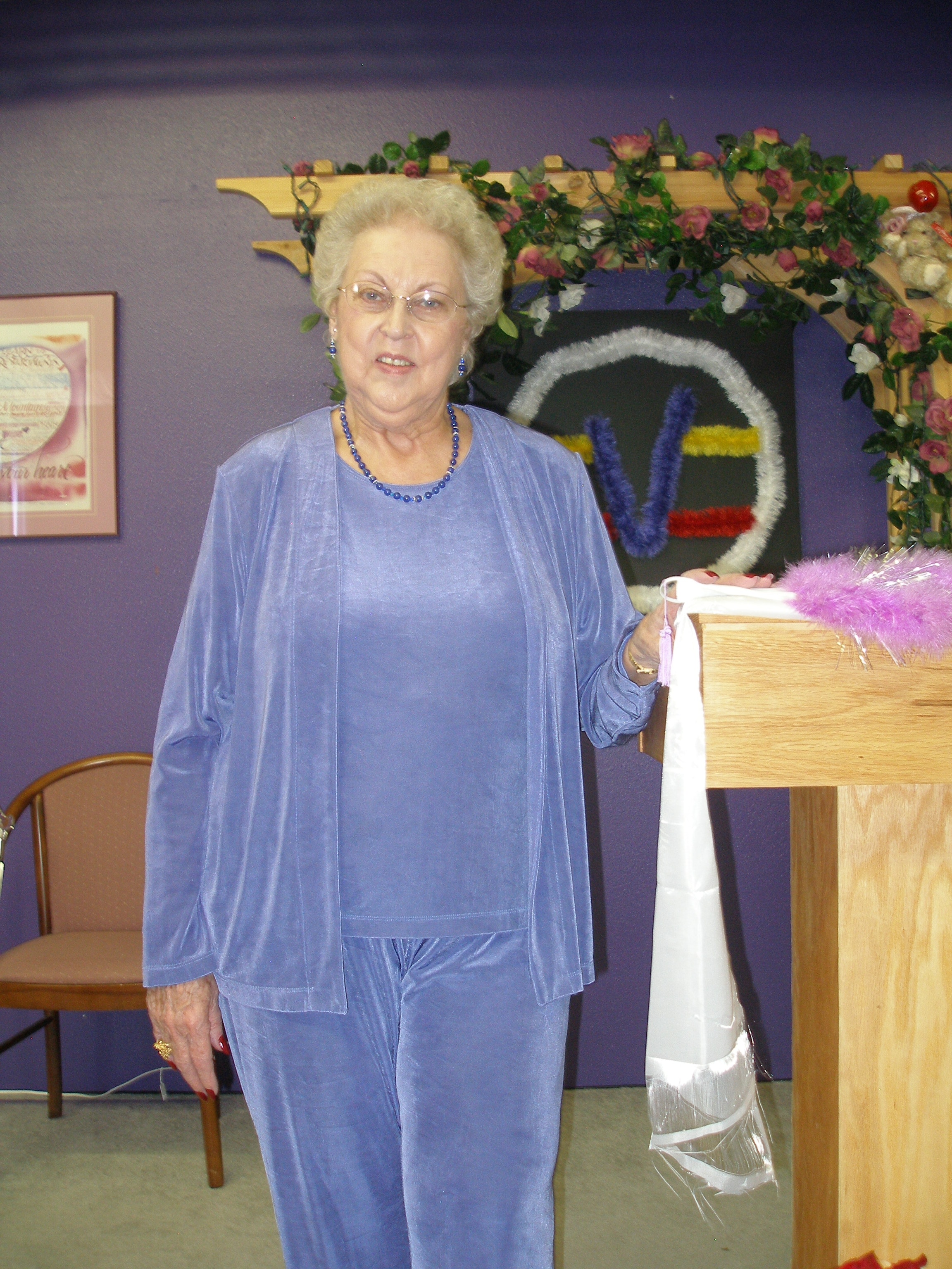 Woman at the Oasis CSL podium with flowers