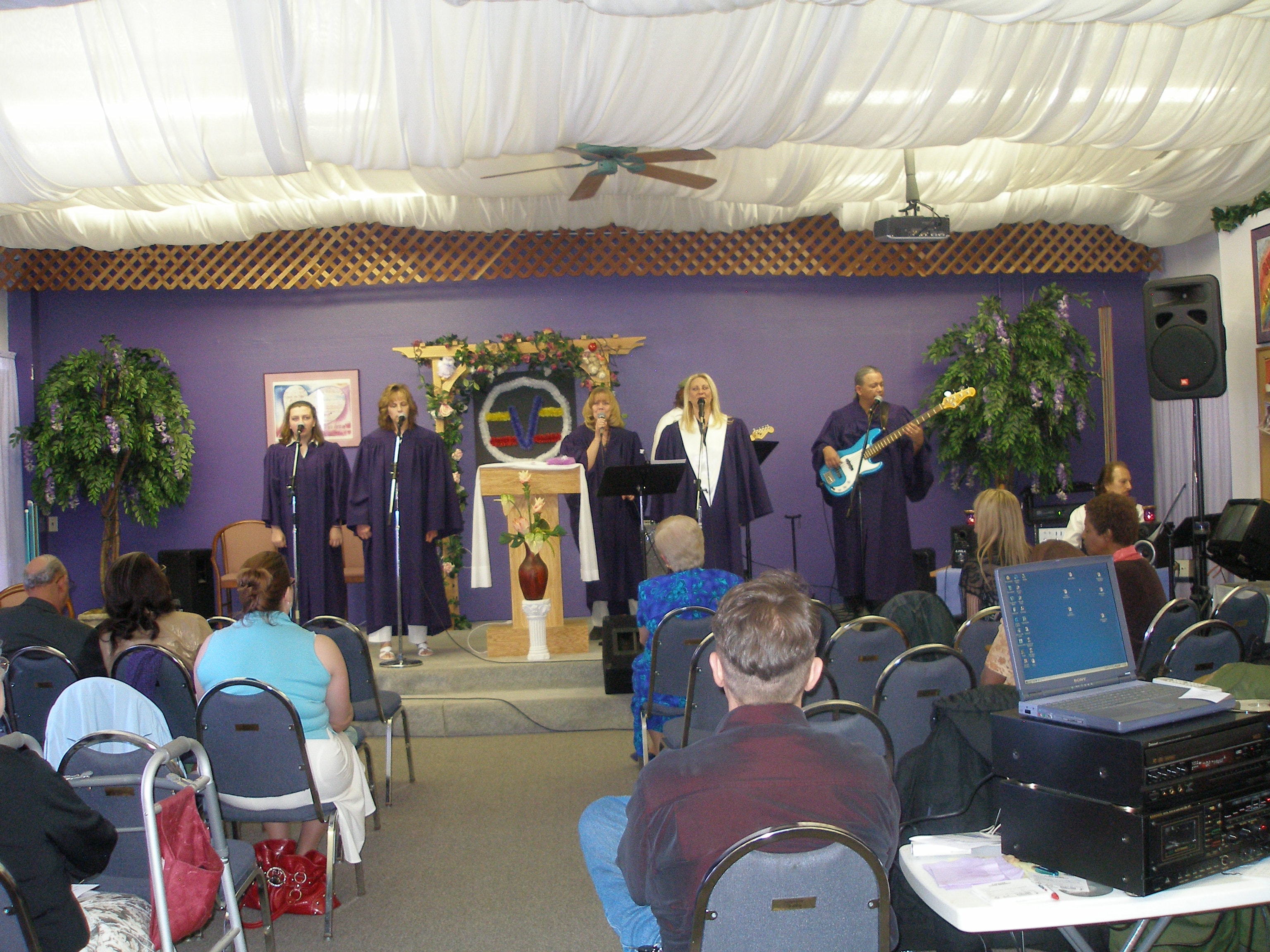 Full choir ensemble on stage at Rev. S. Tucker's ordination