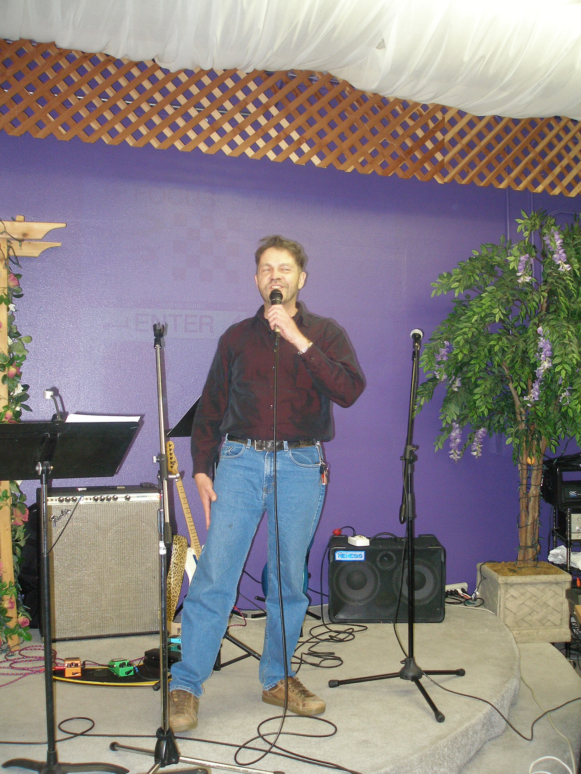 Man singing solo at microphone at Rev. S. Tucker's ordination